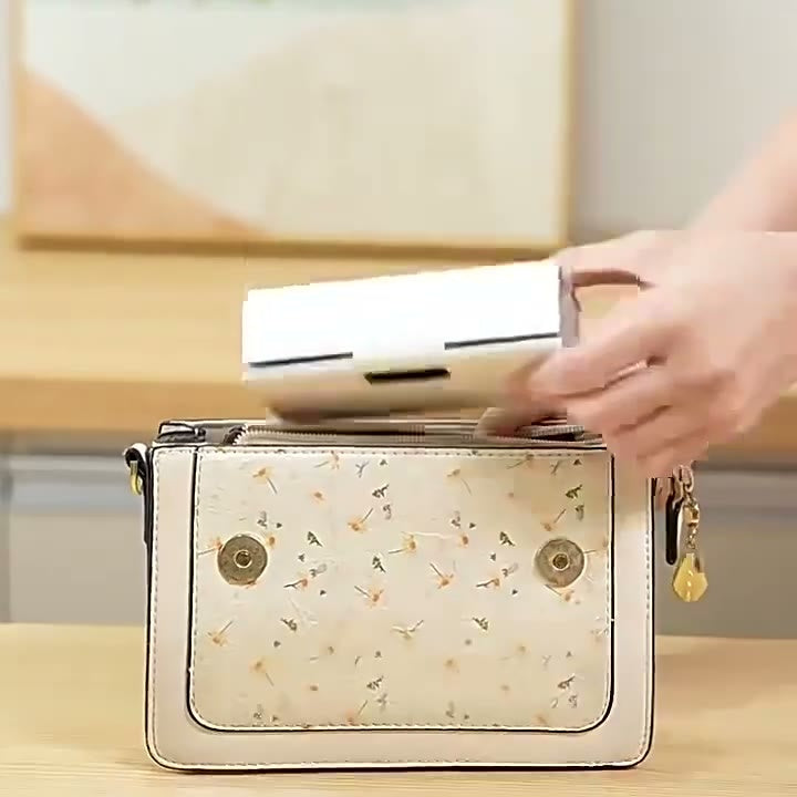 Mini Bag Sealer resting on a light surface, showing its compact size